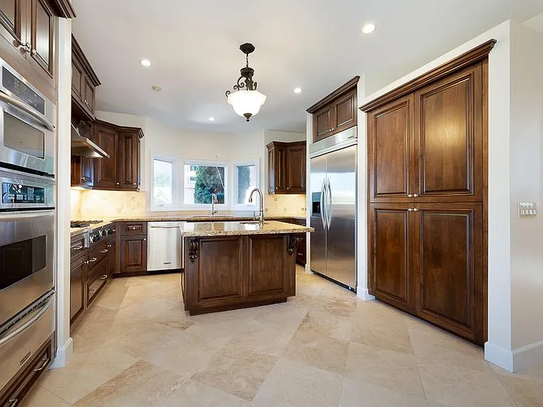 Sit down Breakfast Area leading into nice size Kitchen with ample Pantry Space.