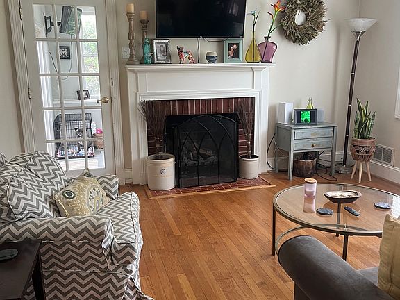Cozy living room with hardwood floors and gas fireplace
