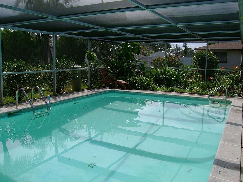 Oversized solar heated pool, custom pond with waterfall