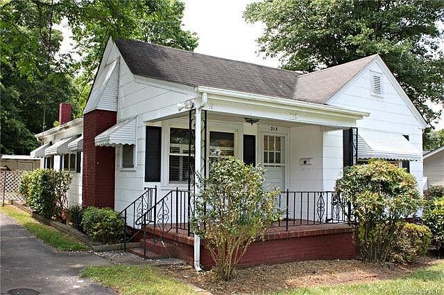 Exterior with large brick front porch.