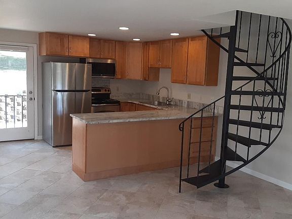 Totally new kitchen with dining room and stairs to the bedrooms and bath