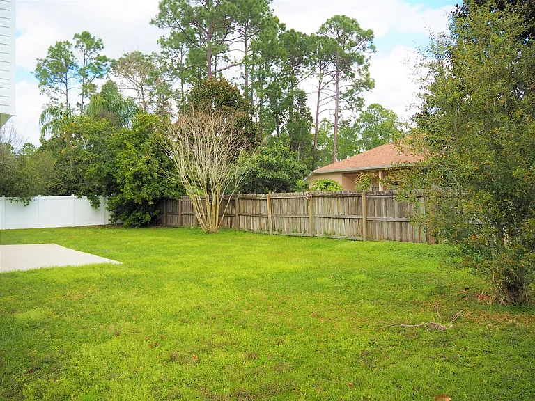 Fenced back yard and patio.