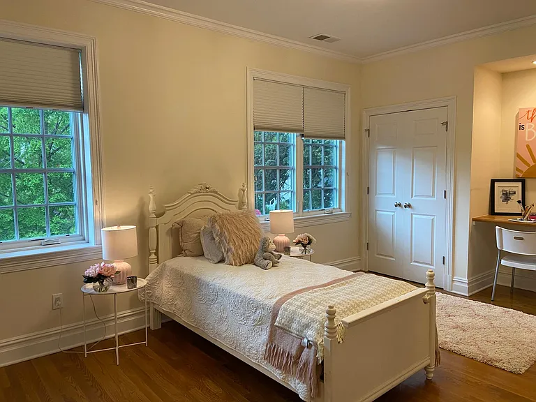 Bedroom 3 with double closets and built-in desk space.
