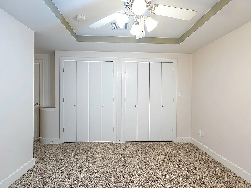 1st Floor bedroom, view from patio to closets.
