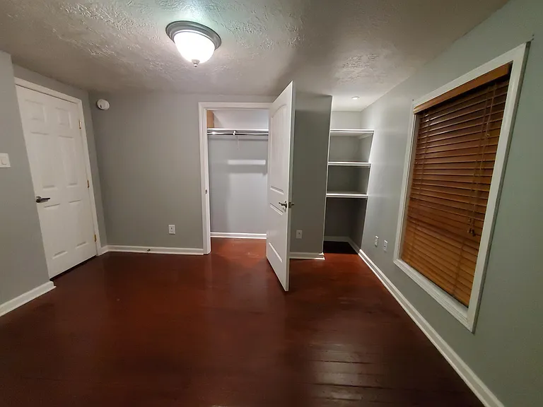Master bedroom with custom lighted shelves.