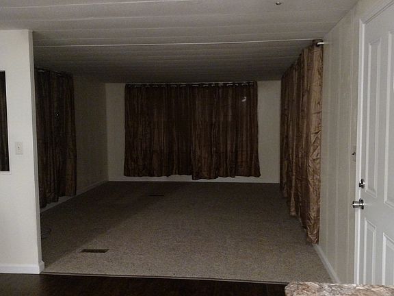 Livingroom 5 windows plus 2 large ones on front wall very br