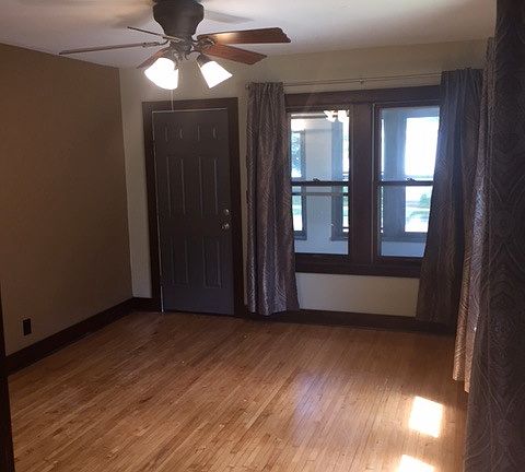 main living room with ceiling fan