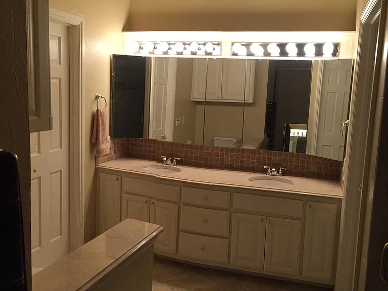 dual sinks with Master BR with his and hers walk-in closets