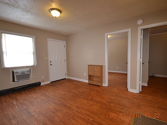 Common room towards entrance and 2 bdrms