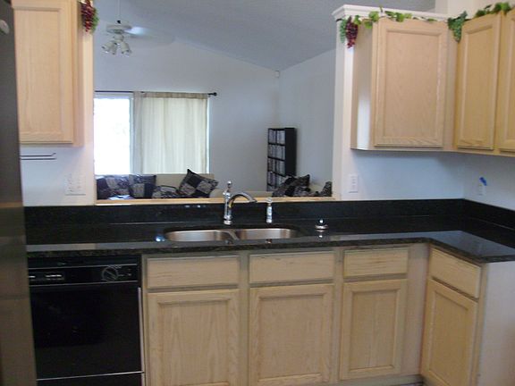 new granite countertops,bottom cabinets have rollout shelving, 