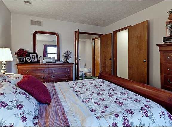  King size owner's suite, double doors open to one area of the bath with tub. 