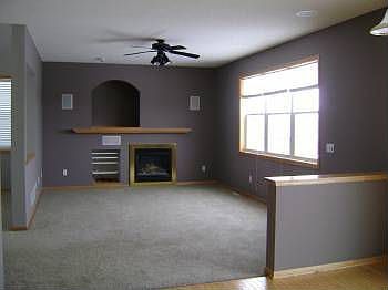 Familyroom w/gas fireplace overlooking pond.