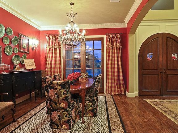 Another view of the dining room with french doors leading to front of home. 