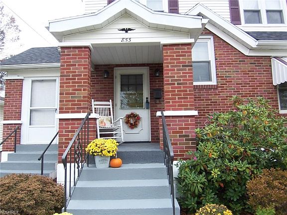 Covered front, side and back porches and sunroom to left