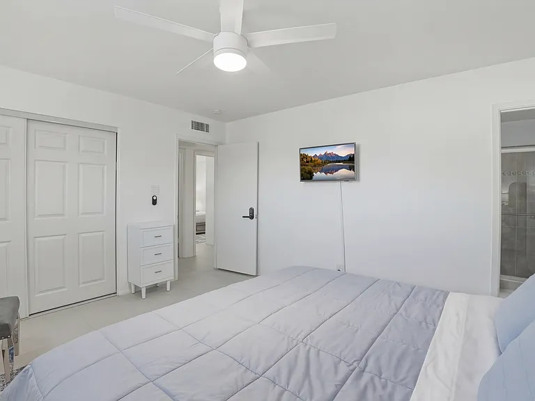 Large closet with a chest of drawers for extra storage.