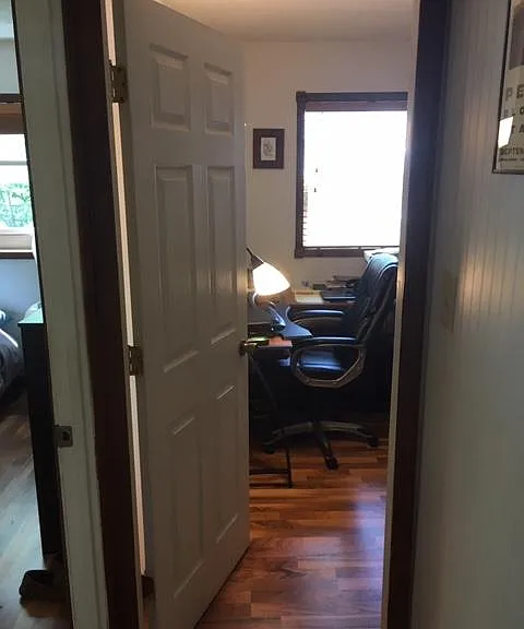 bedroom 2 with wood flooring.