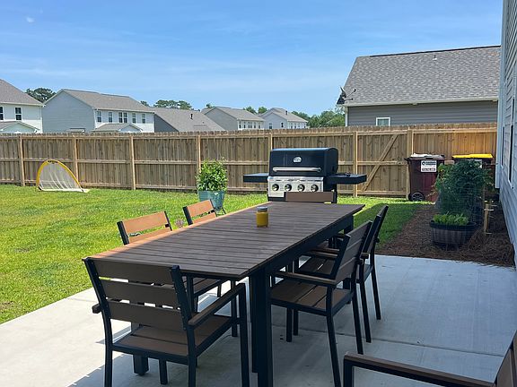 Backyard - uncovered patio, herb and vegetable garden