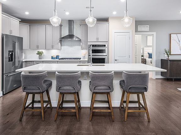 Gourmet Kitchen Open to the Dining Space and Gathering Room