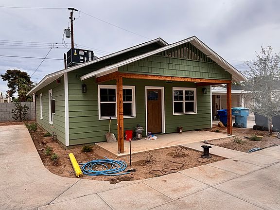 FRONT OF UNIT 2 ( GREEN HOUSE)- PARKING FOR THIS UNIT IS 2 SPACES TO THE EAST IN TANDEM - ONE IS COVERED.