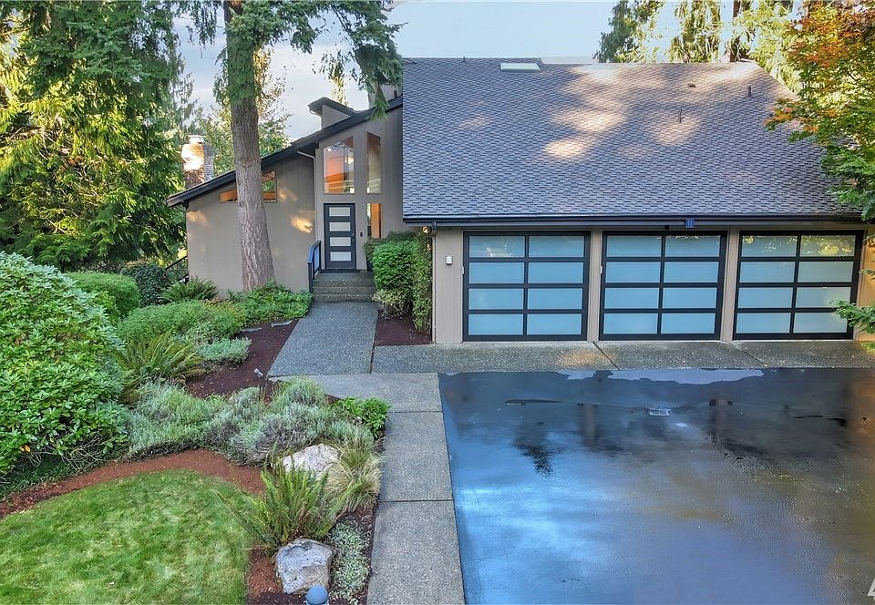 Nestled on a private lane in coveted Brookside Acres, this light-filled Northwest Contemporary embodies timeless appeal while embracing our beloved indoor/outdoor lifestyle.