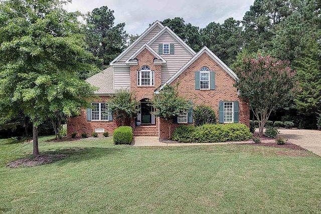Front exterior, side load garage