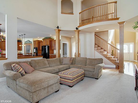 Family room with fireplace and surround sound with speakers.