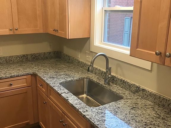 Kitchen with new cabinets and granite countertops.