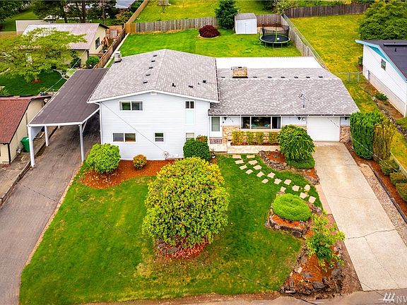 Look at the spacious yard and plenty of parking, 1 car garage, long driveway, plus covered parking for more!