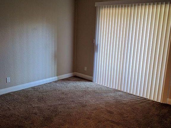 baster bed with sliding door to laundry 