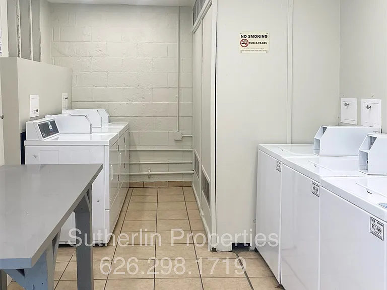 Shared coin/app operated laundry facility open 24/7