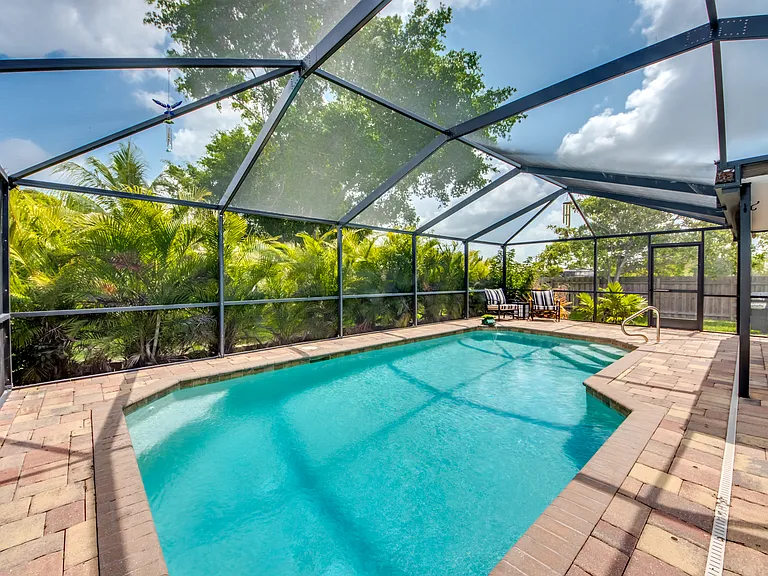 Heated pool in lanai enclosure with optional child safety fence