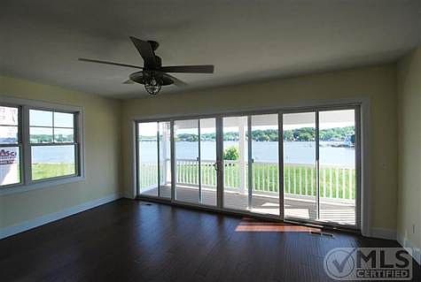 Dining Area With View of Harbor and sliders to deck