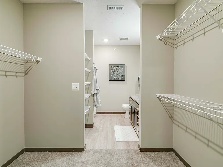 Keep everything organized in a roomy walk-in closet with built-in shelving.