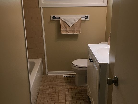Bathroom features tiled floor.