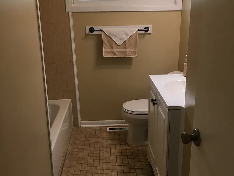 Bathroom features tiled floor.