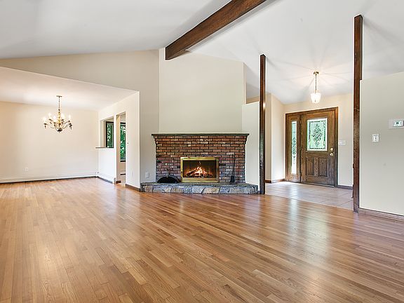 Vaulted Living Room with brick fireplace.