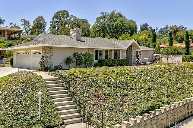 Front showing the Burrage mansion cut stone wall