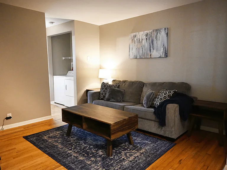 Living room and in-unit washer and dryer at Slips at Blackstone.