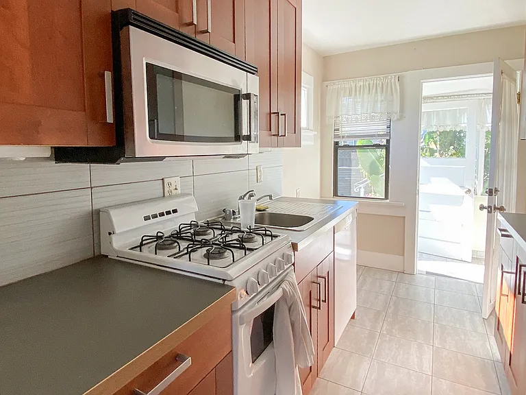 Kitchen - View towards the laundry room and backdoor
