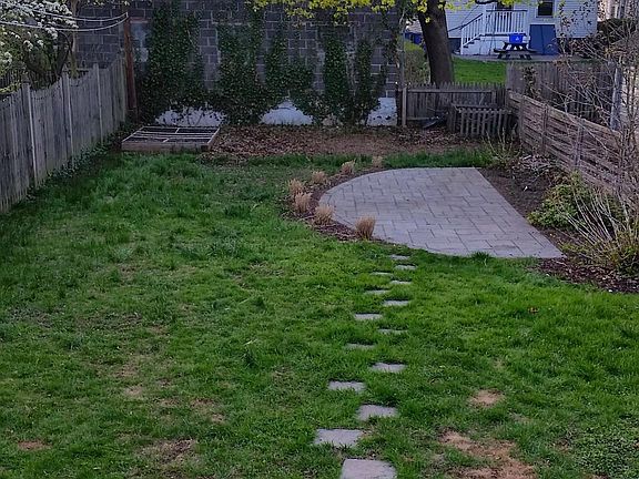 Back yard, tulips every spring. Has patio furniture not pictured here