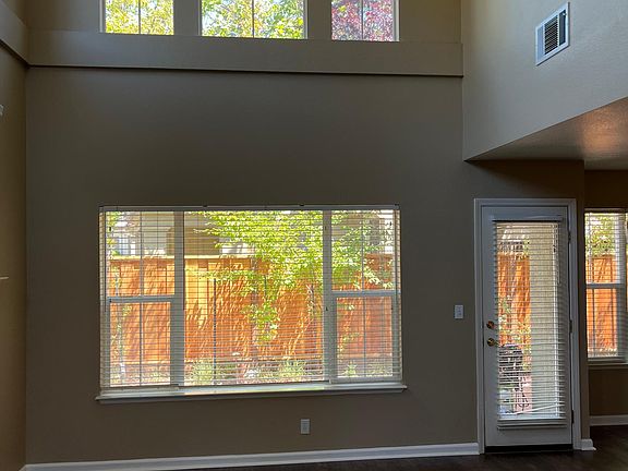 Entry to your living room, high ceilings and abundance of windows for sunlight