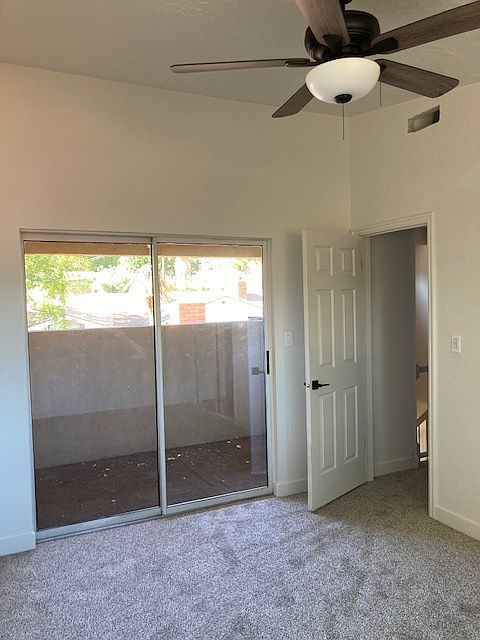 View of entrance to bedroom for rent, along with sliding glass door to a private patio.