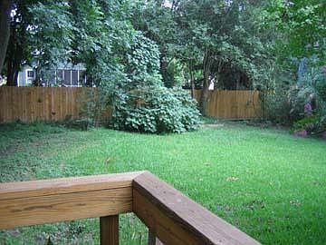 View of fenced yard from deck