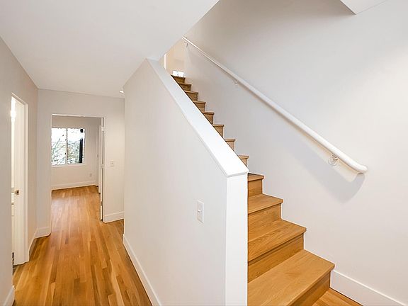 Entry Level / Street level. Stairs headed to 2nd level. 1 bathroom and bedroom on this level