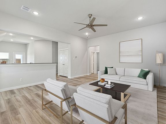 Living room in the Amber home plan by Trophy Signature Homes - REPRESENTATIVE PHOTO