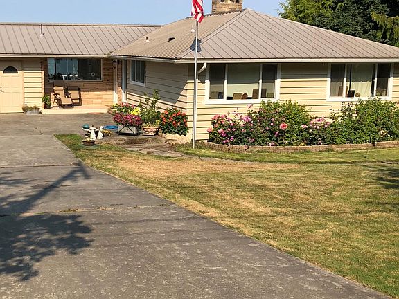 Don't let the modest exterior fool you; inside are walls of windows, extensive modern upgrades, and highest-quality finishing details.