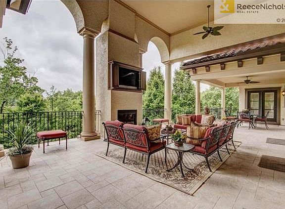 Upper level patio overlooking gardens and pool