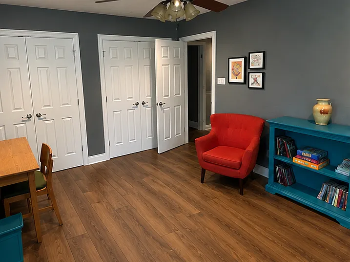 AI adjusted photo to show the upgrade to LVP flooring. NO carpet in the house.