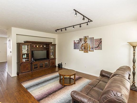 Engineered hardwood floors installed in 2014.  Entertainment center made specifically for this room.