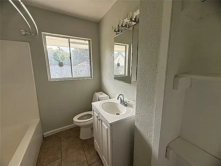Bathroom. With a linen closet behind the door.